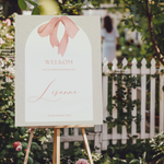 Welkomstbord voor babyshower met roze strik ontwerp