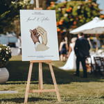 Welkomstbord voor bruiloft met donker + licht ontwerp